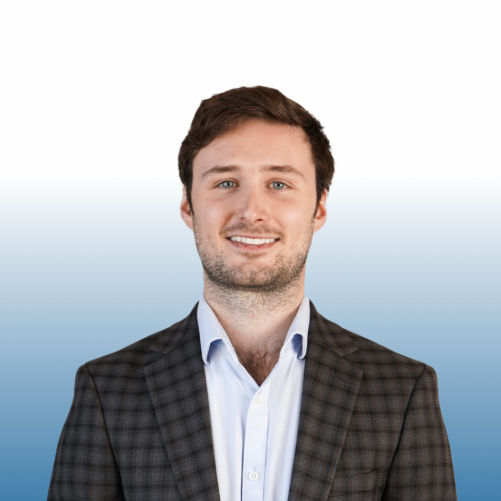 Young male Equity team member in a plaid blazer and dress shirt